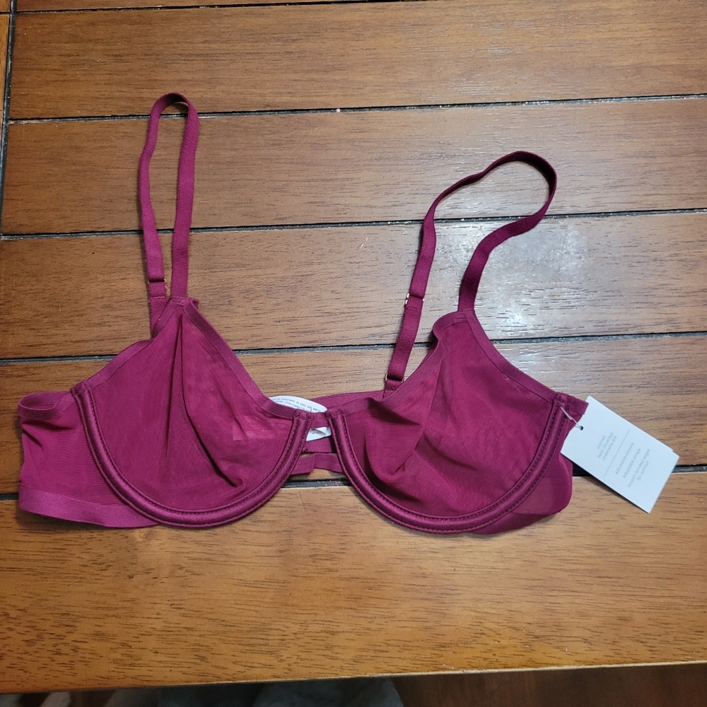 Womans 36 A dark purple net material bra